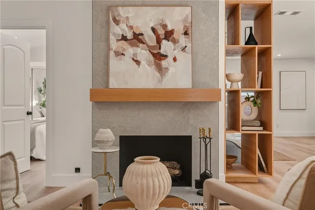 a living room with lots of furniture and kitchen view