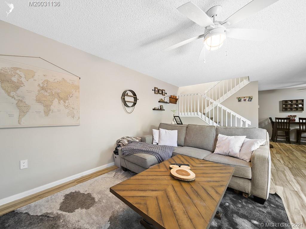 5804 Southeast Windsong Lane Stuart, FL 34997 - Photo 6 of 20 a living room with furniture and wooden floor