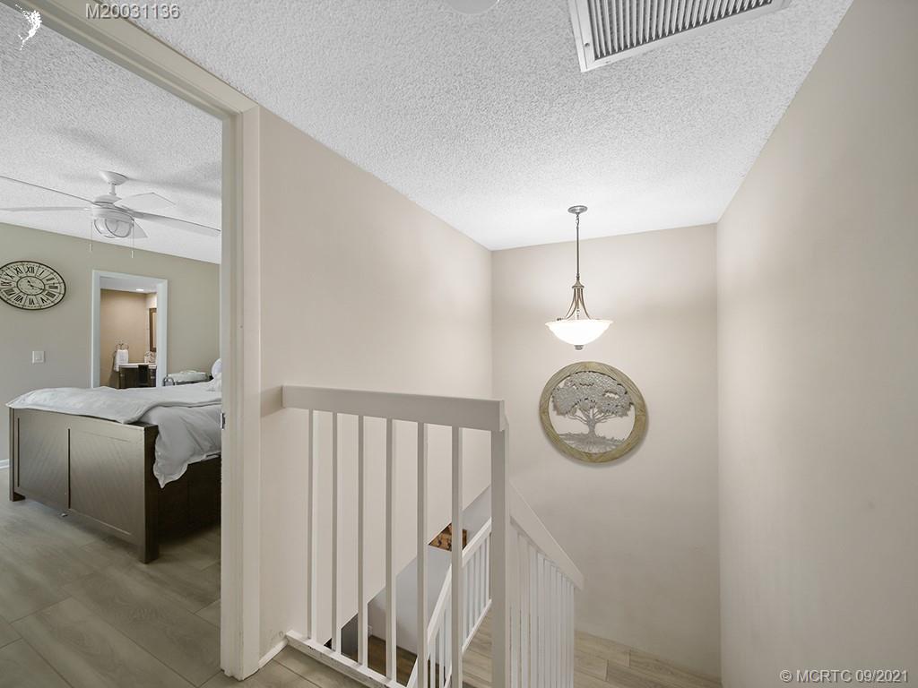 5804 Southeast Windsong Lane Stuart, FL 34997 - Photo 8 of 20 a view of a hallway with elevator