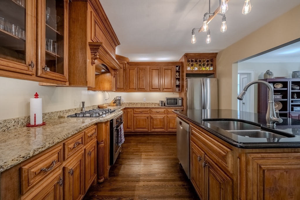 7 Argyle Street Worcester, MA 01609 - Photo 2 of 41 a kitchen with stainless steel appliances granite countertop a sink and a refrigerator