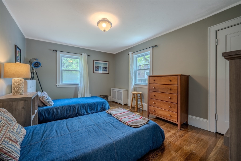 7 Argyle Street Worcester, MA 01609 - Photo 25 of 41 a bedroom with a bed and a dresser