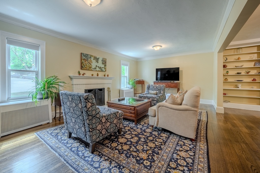 7 Argyle Street Worcester, MA 01609 - Photo 3 of 41 a living room with furniture a fireplace and a flat screen tv