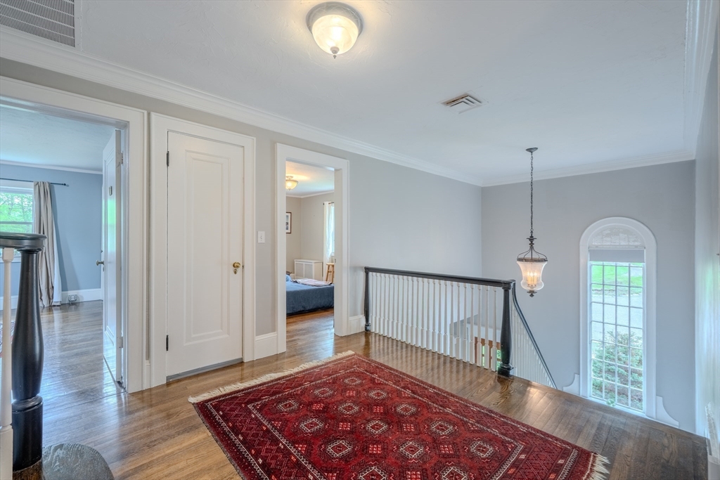 7 Argyle Street Worcester, MA 01609 - Photo 31 of 41 a view of a hallway with wooden floor and a rug