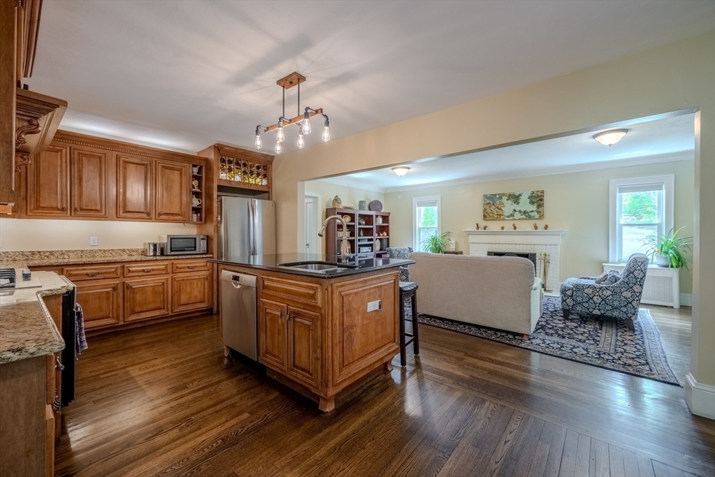 7 Argyle Street Worcester, MA 01609 - Photo 10 of 41 a kitchen with granite countertop a sink cabinets and wooden floor