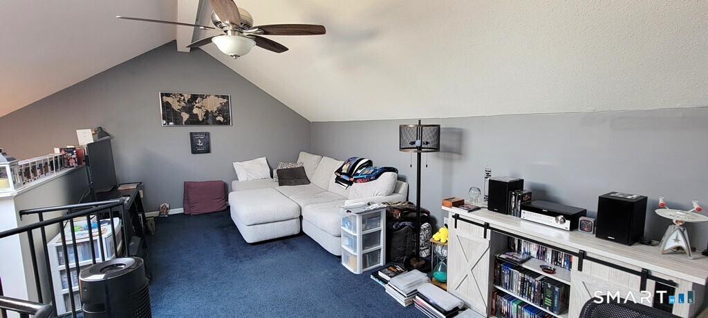 10 Taft Pointe, Unit 2 Waterbury, CT 06708 - Photo 11 of 18 a bedroom with furniture and a book shelf