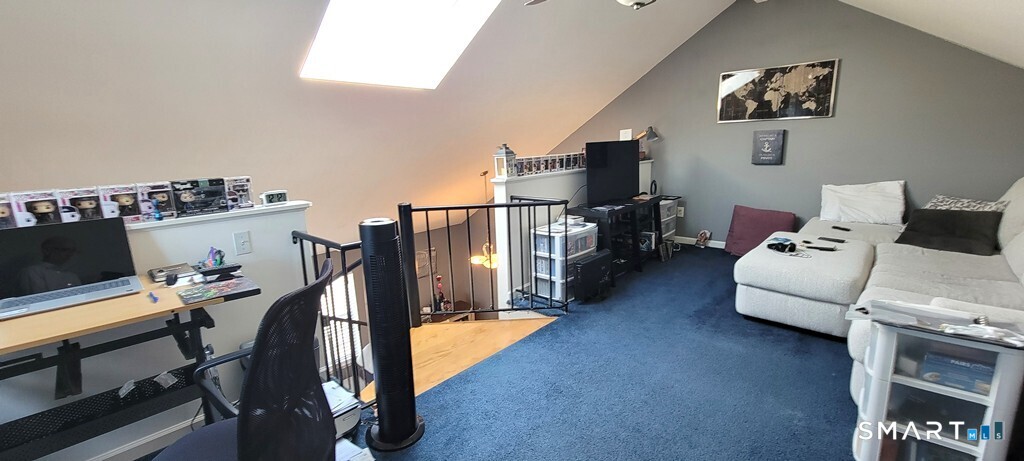 10 Taft Pointe, Unit 2 Waterbury, CT 06708 - Photo 12 of 18 a living room with furniture and a flat screen tv