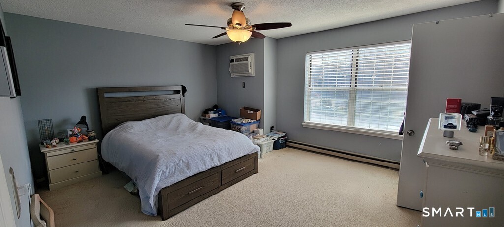 10 Taft Pointe, Unit 2 Waterbury, CT 06708 - Photo 14 of 18 a bedroom with a bed and a window