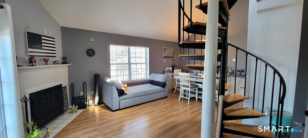 10 Taft Pointe, Unit 2 Waterbury, CT 06708 - Photo 2 of 18 a living room with furniture and a fireplace