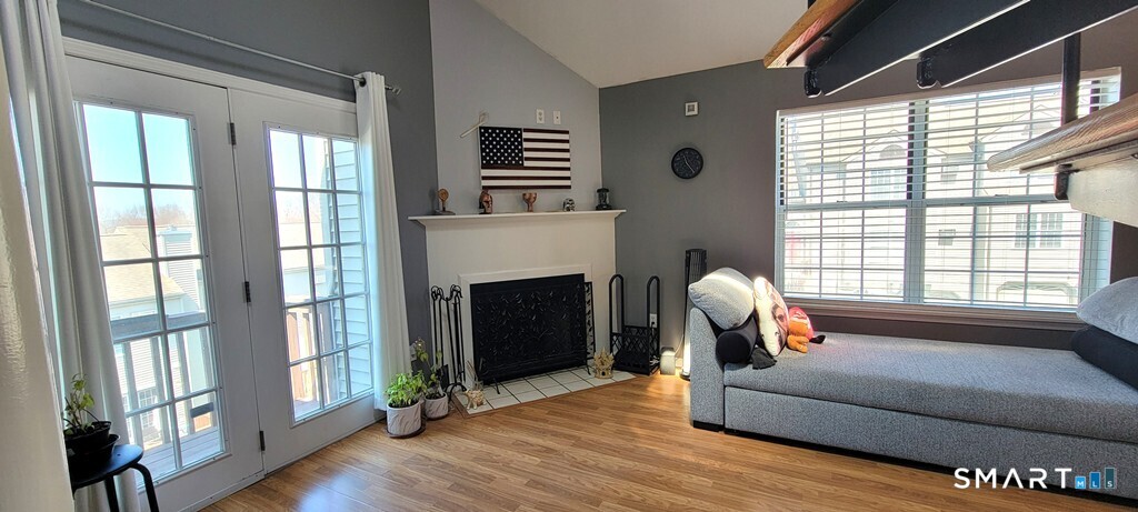 10 Taft Pointe, Unit 2 Waterbury, CT 06708 - Photo 3 of 18 a living room with furniture and a fireplace