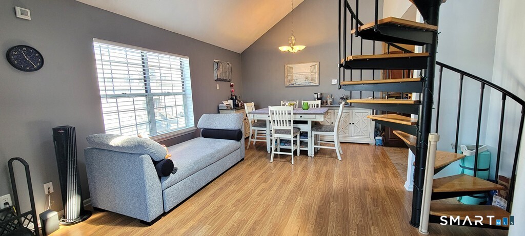 10 Taft Pointe, Unit 2 Waterbury, CT 06708 - Photo 5 of 18 a living room with furniture a window and wooden floor