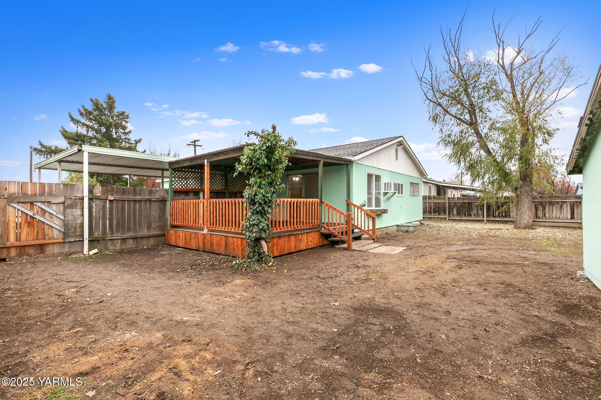 503 North Chestnut Street Toppenish, WA 98948 - Photo 21 of 21 a view of backyard with a garden and deck