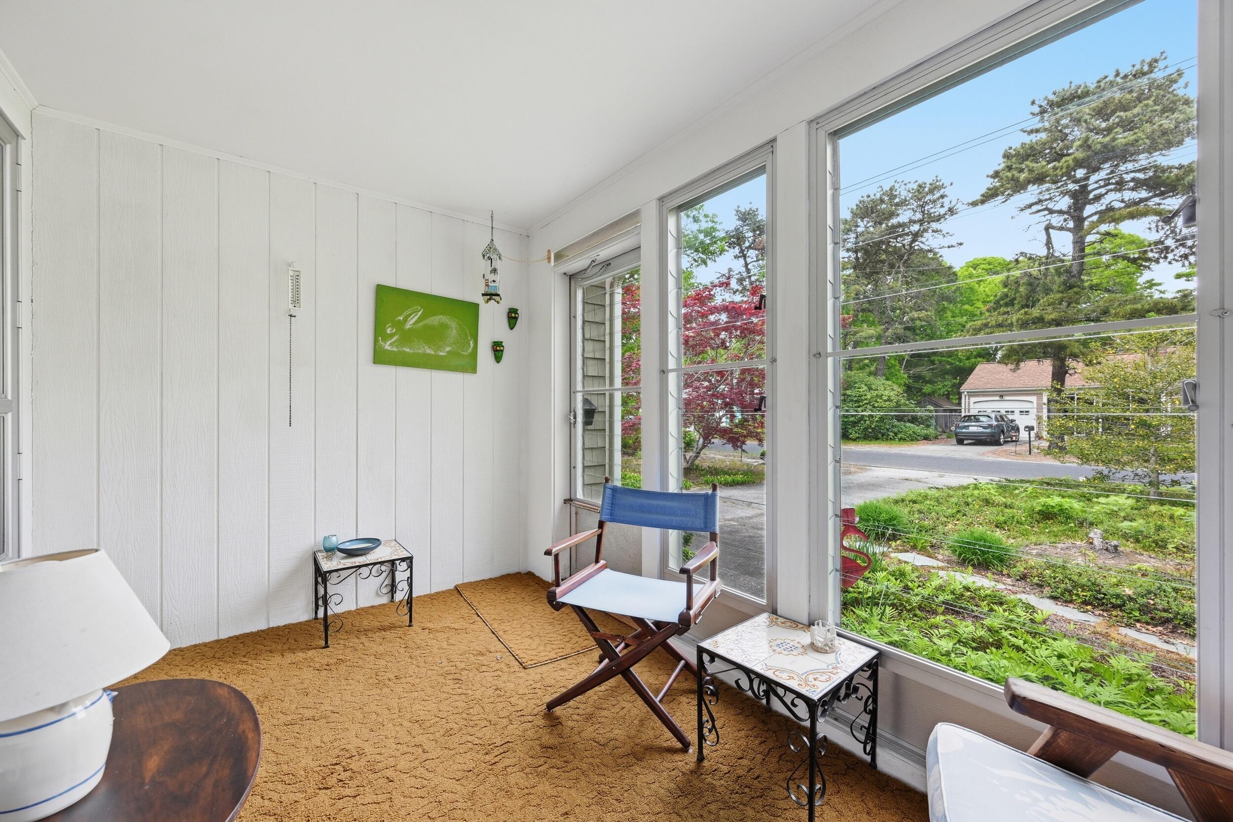 59 Beverly Road West Yarmouth, MA 02673 - Photo 23 of 33 a living room with a couch and a large window