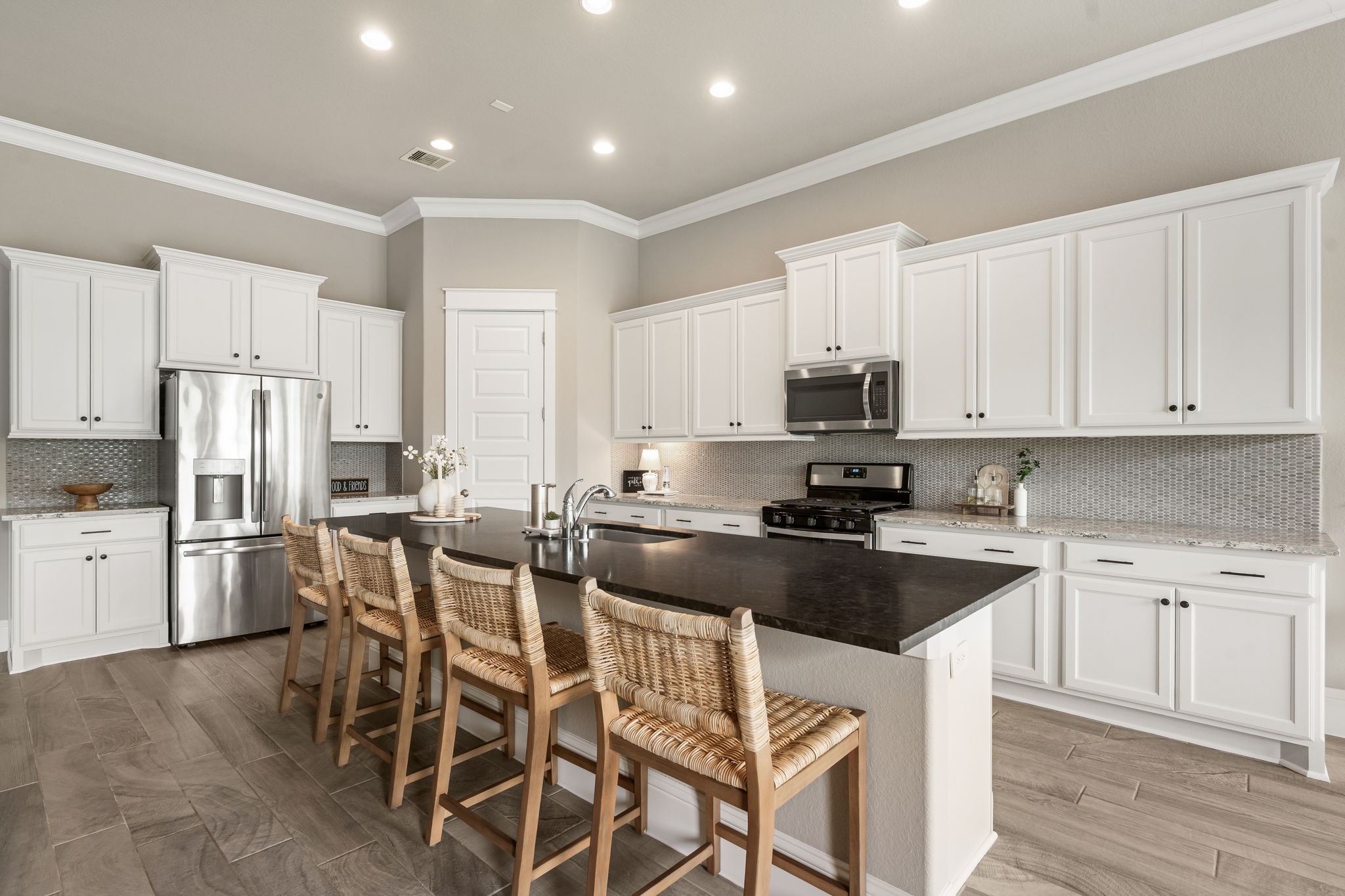 2206 Rope Maker Road Conroe, TX 77384 - Photo 23 of 42 Chef’s kitchen features abundant cabinetry, expansive counters, and timeless finishes.
