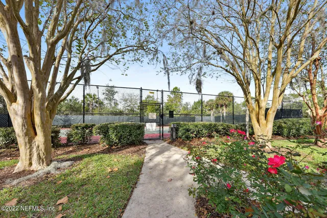 a view of a house with pool and sitting area
