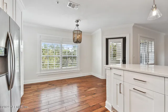 a kitchen with stainless steel appliances granite countertop a sink stove and microwave