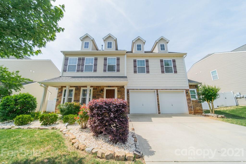 7062 Meyer Road Fort Mill, SC 29715 - Photo 1 of 46 a front view of a house with garden