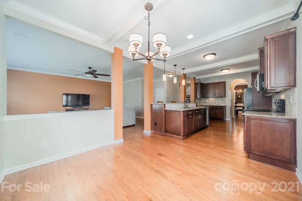 7062 Meyer Road Fort Mill, SC 29715 - Photo 15 of 46 a large kitchen with a lot of cabinets and stainless steel appliances