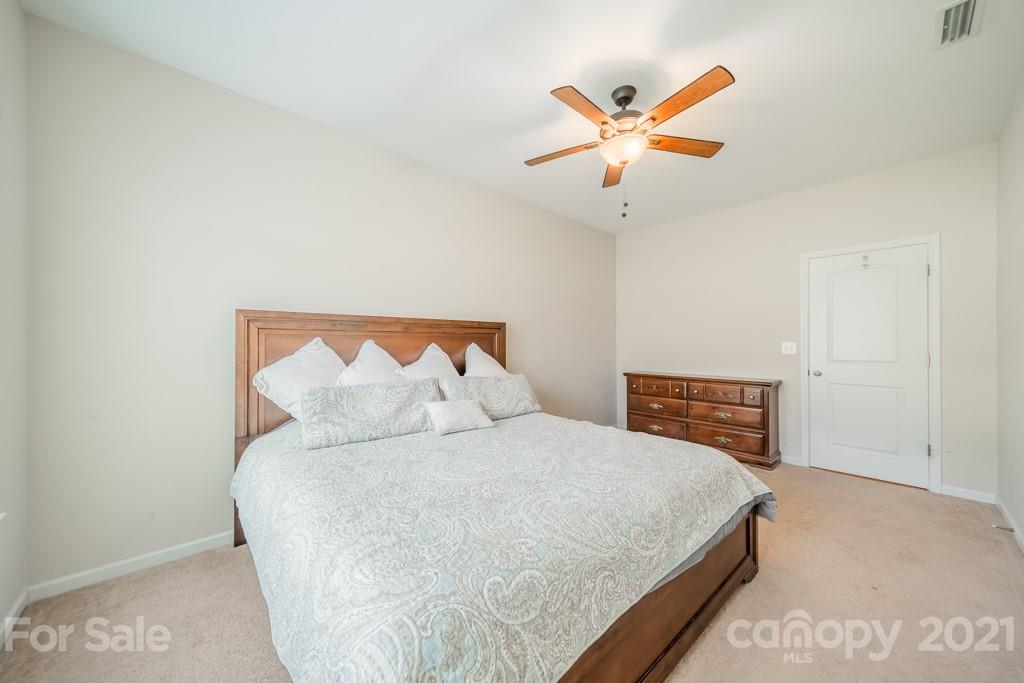 7062 Meyer Road Fort Mill, SC 29715 - Photo 19 of 46 a bedroom with a bed and window