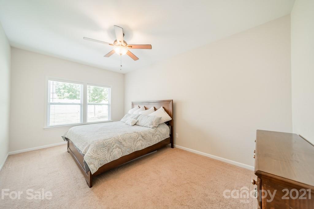 7062 Meyer Road Fort Mill, SC 29715 - Photo 20 of 46 a spacious bedroom with a bed and a window