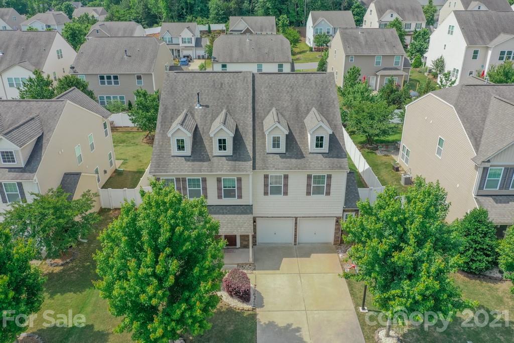 7062 Meyer Road Fort Mill, SC 29715 - Photo 3 of 46 an aerial view of multiple houses with a yard