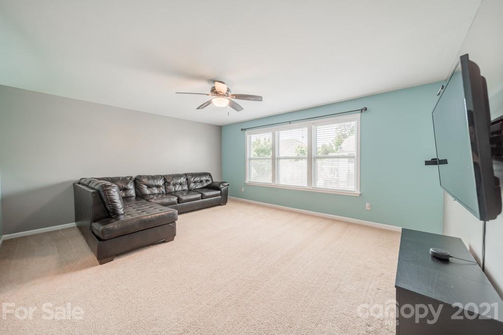 7062 Meyer Road Fort Mill, SC 29715 - Photo 21 of 46 a living room with furniture and a flat screen tv