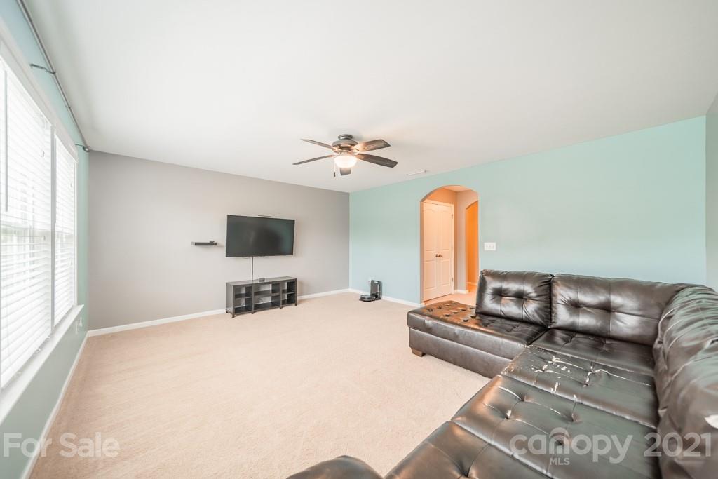 7062 Meyer Road Fort Mill, SC 29715 - Photo 23 of 46 a bedroom with a bed and a flat screen tv
