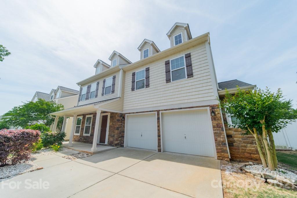 7062 Meyer Road Fort Mill, SC 29715 - Photo 4 of 46 a front view of a house with a yard