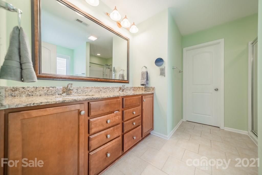 7062 Meyer Road Fort Mill, SC 29715 - Photo 31 of 46 a bathroom with a granite countertop sink and a mirror