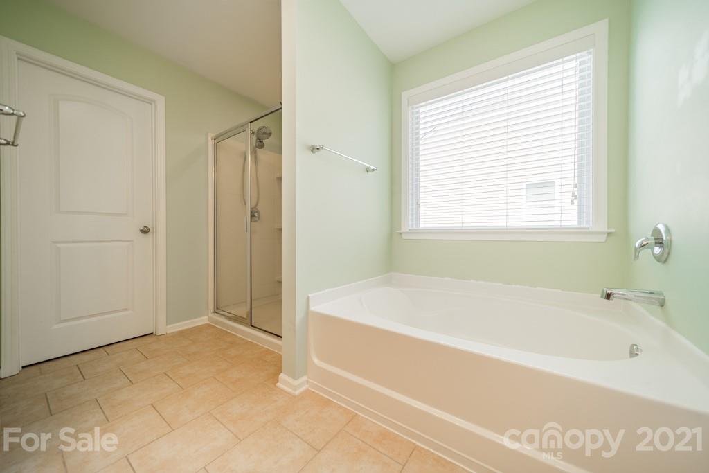7062 Meyer Road Fort Mill, SC 29715 - Photo 32 of 46 a spacious bathroom with a bathtub and shower