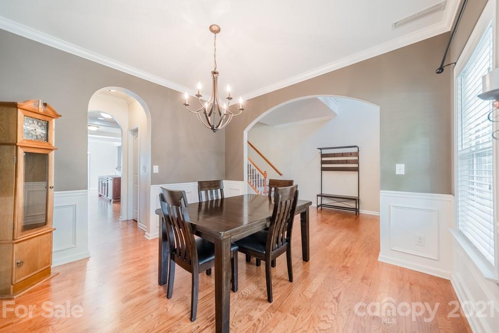 7062 Meyer Road Fort Mill, SC 29715 - Photo 6 of 46 a view of a dining room with furniture window and wooden floor