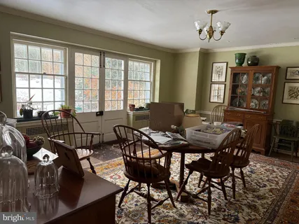 a view of a dining room with furniture and window