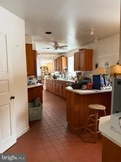 a kitchen with a sink appliances and cabinets