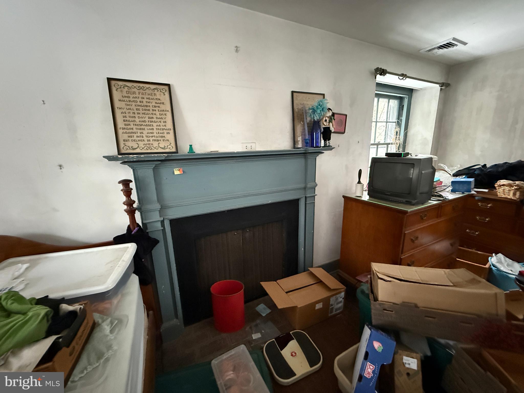 315 Keithwood Road Wynnewood, PA 19096 - Photo 20 of 27 a living room with furniture and a fireplace