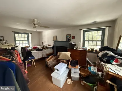 a living room with furniture fireplace and window