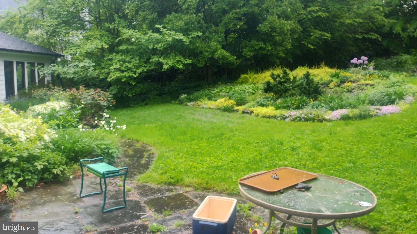 315 Keithwood Road Wynnewood, PA 19096 - Photo 3 of 27 a backyard of a house with a yard fire pit and entertaining space