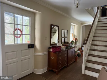a view of a livingroom with furniture and staircase