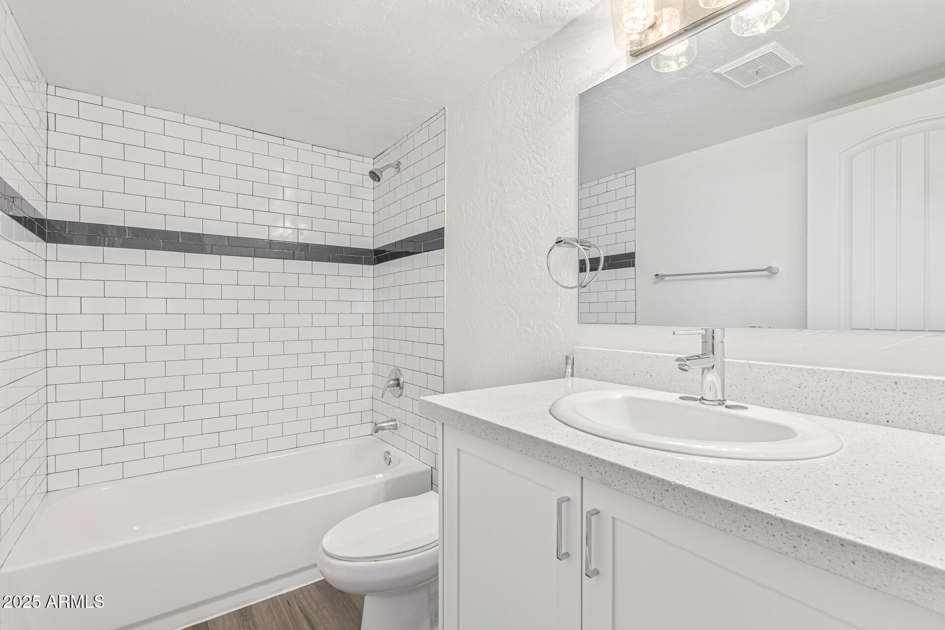 2539 North 48th Street Phoenix, AZ 85008 - Photo 13 of 26 a bathroom with a sink a toilet and shower