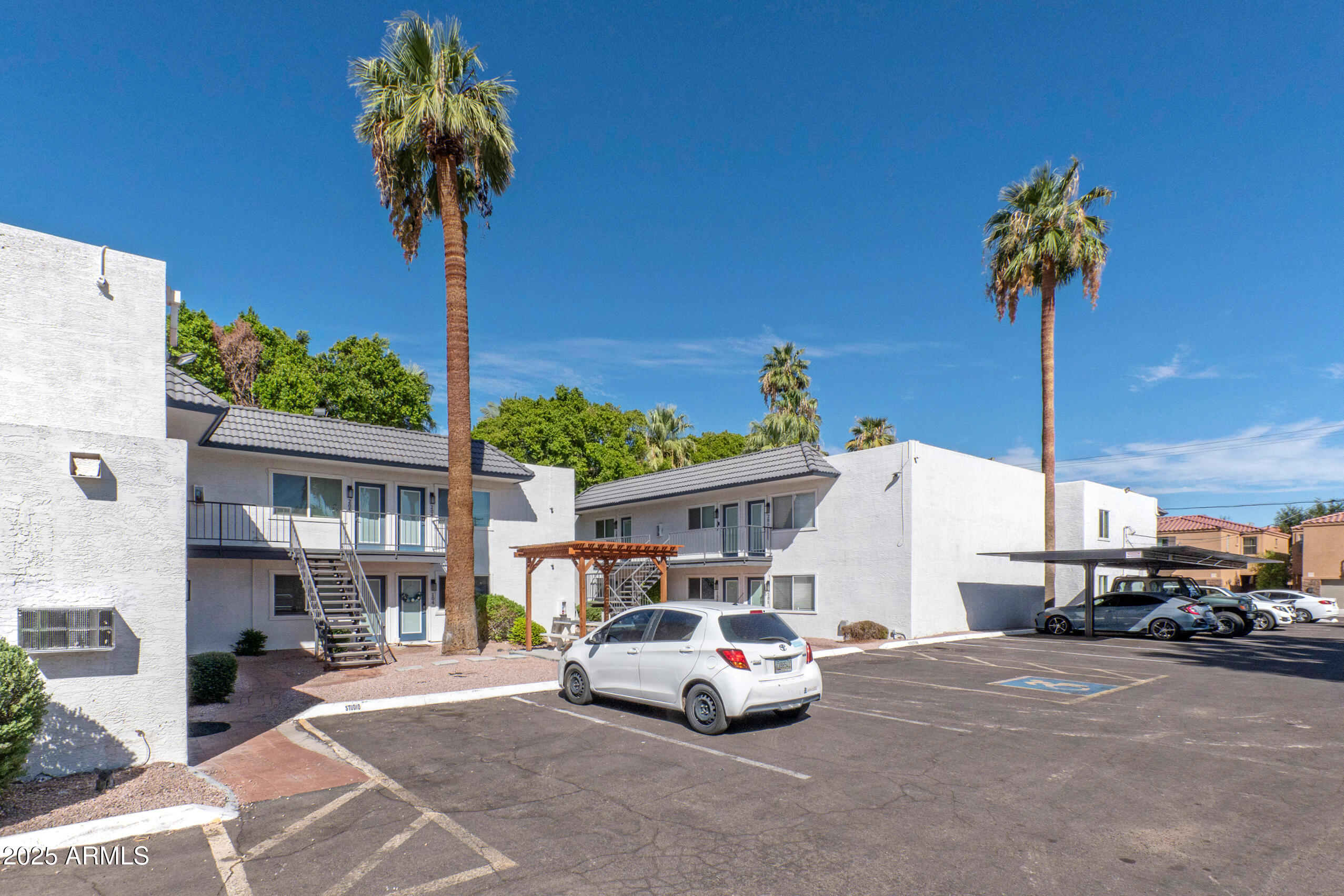 2539 North 48th Street Phoenix, AZ 85008 - Photo 2 of 26 a front view of a house with a garden and patio