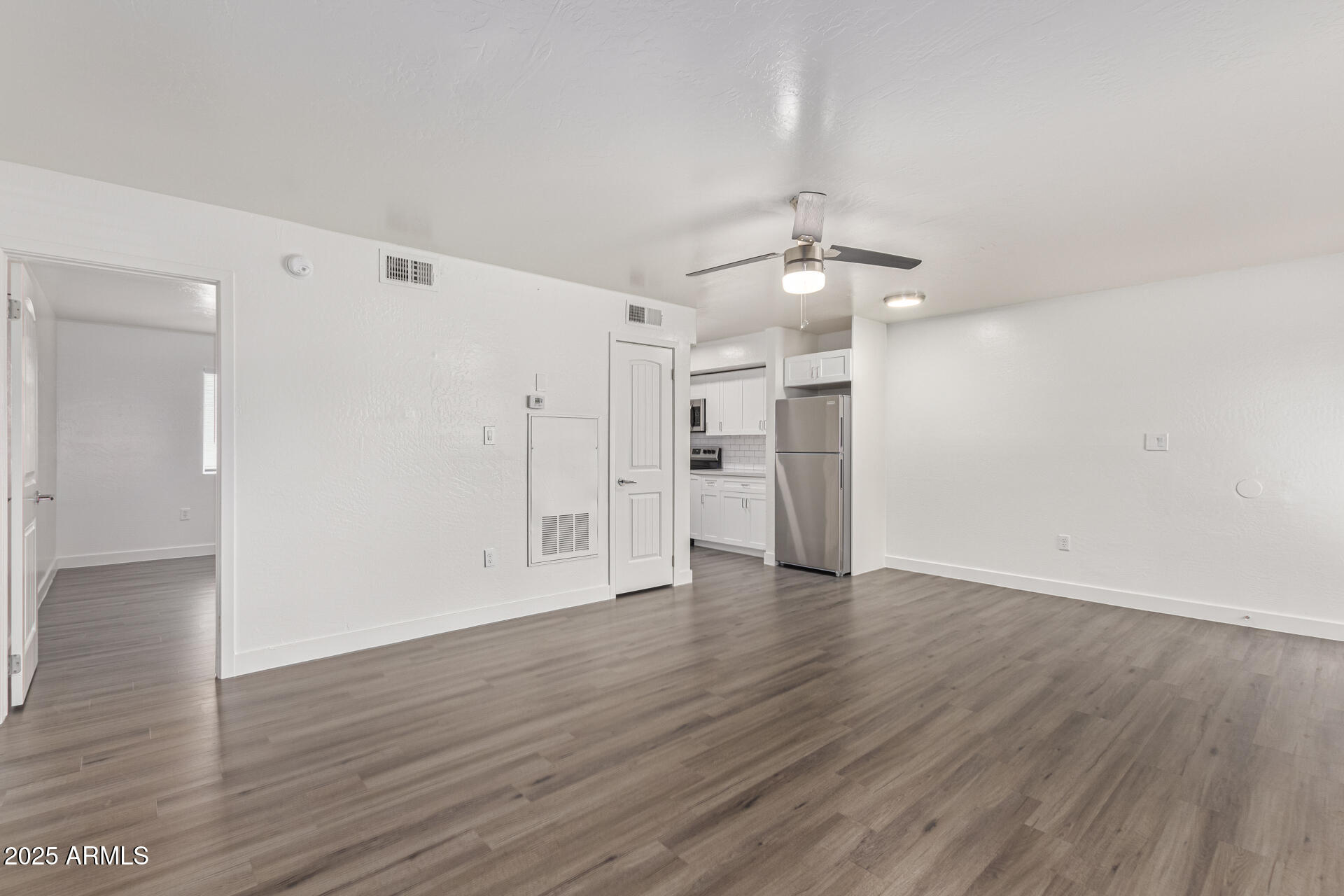 2539 North 48th Street Phoenix, AZ 85008 - Photo 24 of 26 a view of an empty room with wooden floor