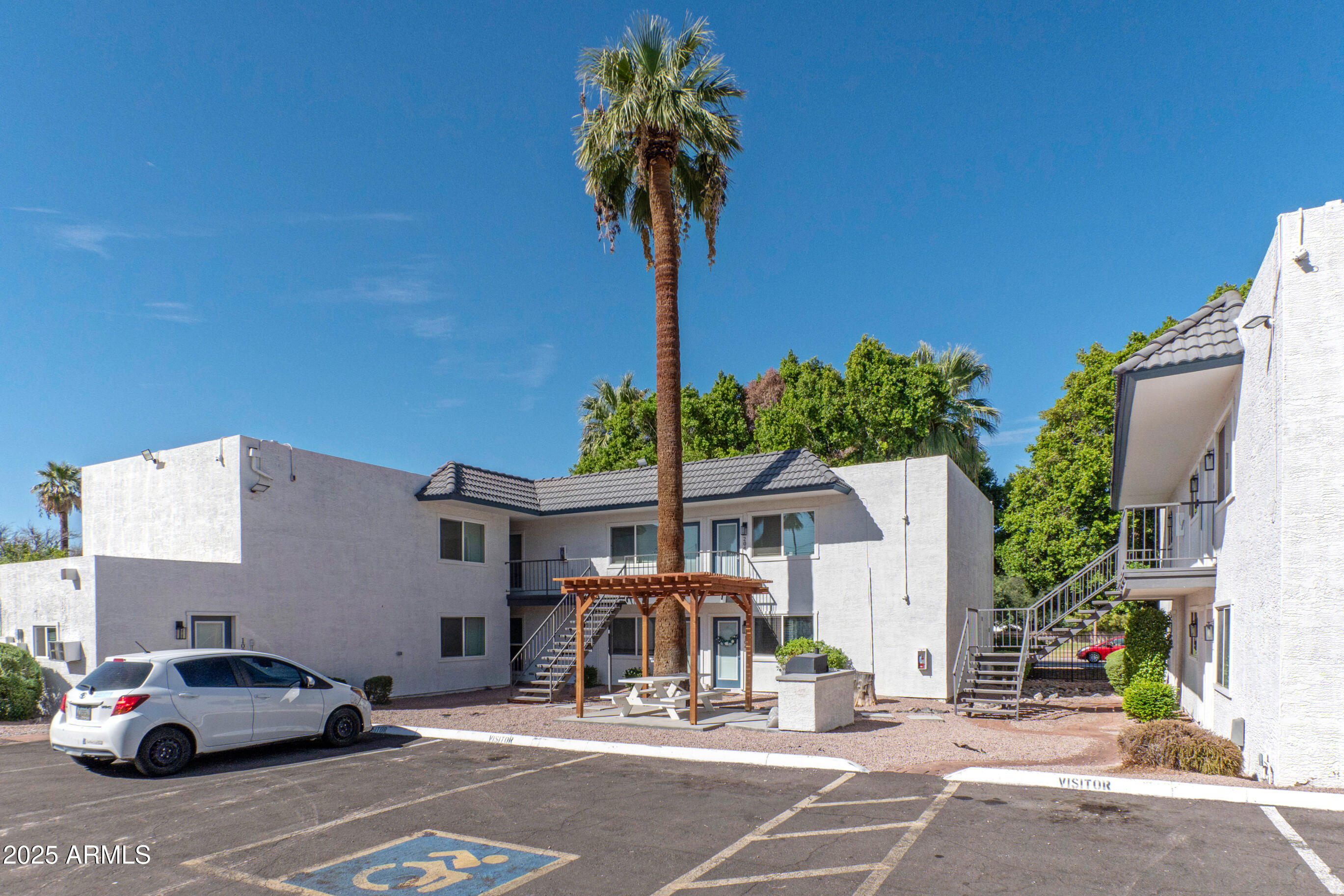 2539 North 48th Street Phoenix, AZ 85008 - Photo 3 of 26 a view of a cars park in front of a building