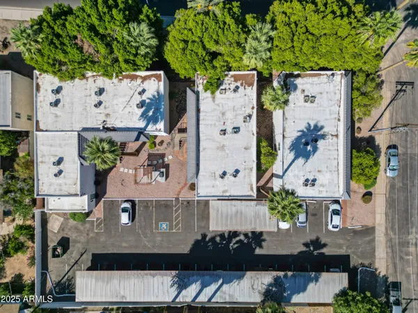 an aerial view of residential houses with outdoor space