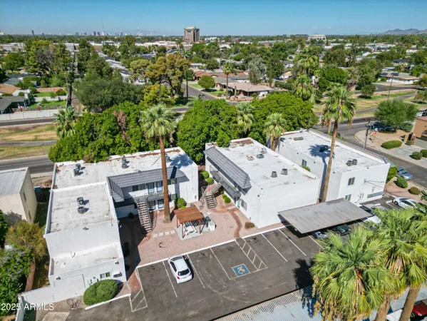 an aerial view of a house with a yard