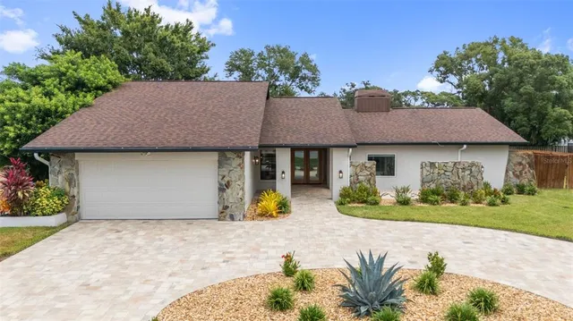front view of a house with a yard