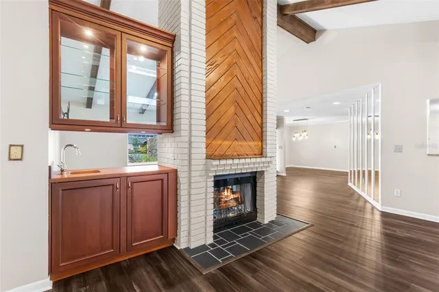 a bathroom with a double vanity sink mirror and toilet