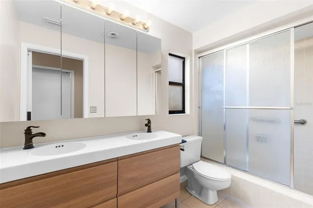a view of a room with wooden floor and cabinet