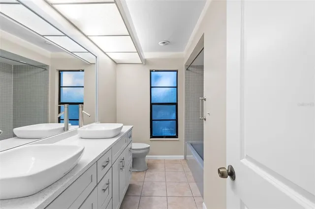 a kitchen with stainless steel appliances a refrigerator and cabinets