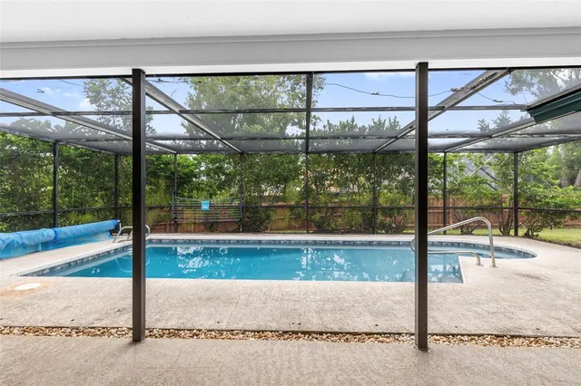 a view of a house with basketball court