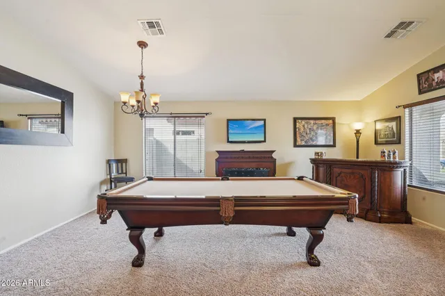 a view of a room with furniture and wall paintings