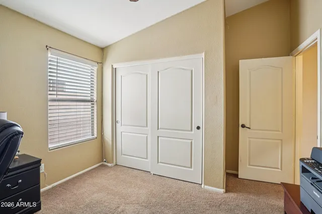 a view of workspace with a window and gym equipment