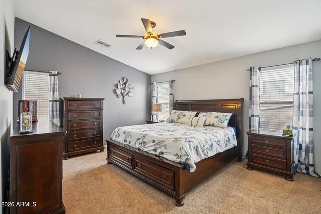 a utility room with dryer washer and shoe rack